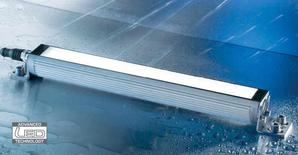 TUBELED_40 II LED machine light in splash water application, mounted on a metal surface; rugged, waterproof housing for harsh industrial environments.